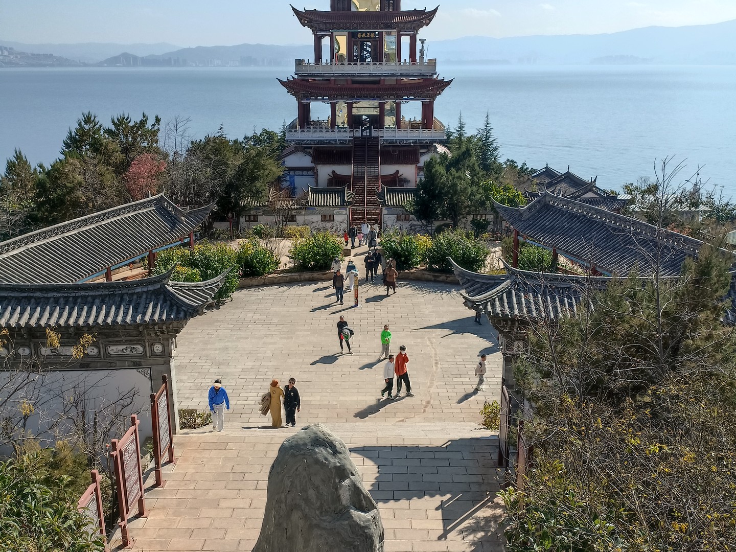 Tianjing Pavilion rising above its courtyard, with Erhai Lake behind