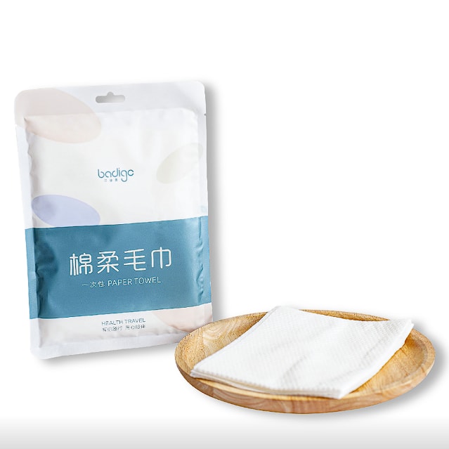 Disposable compressed thickened bath towel with individual packaging · CUIHUASHI